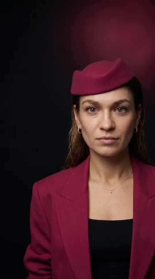 AI portrait of a woman in a burgundy beret and blazer, vertical 9:16